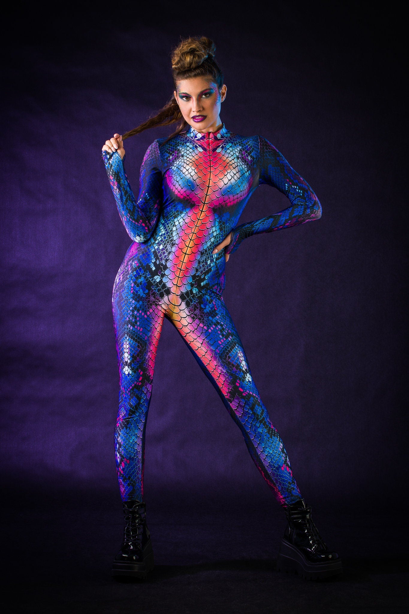 Blue Snake Halloween costume for women, featuring a snake skin jumpsuit with tattoo effect on the back, perfect for Halloween parties or music festivals.