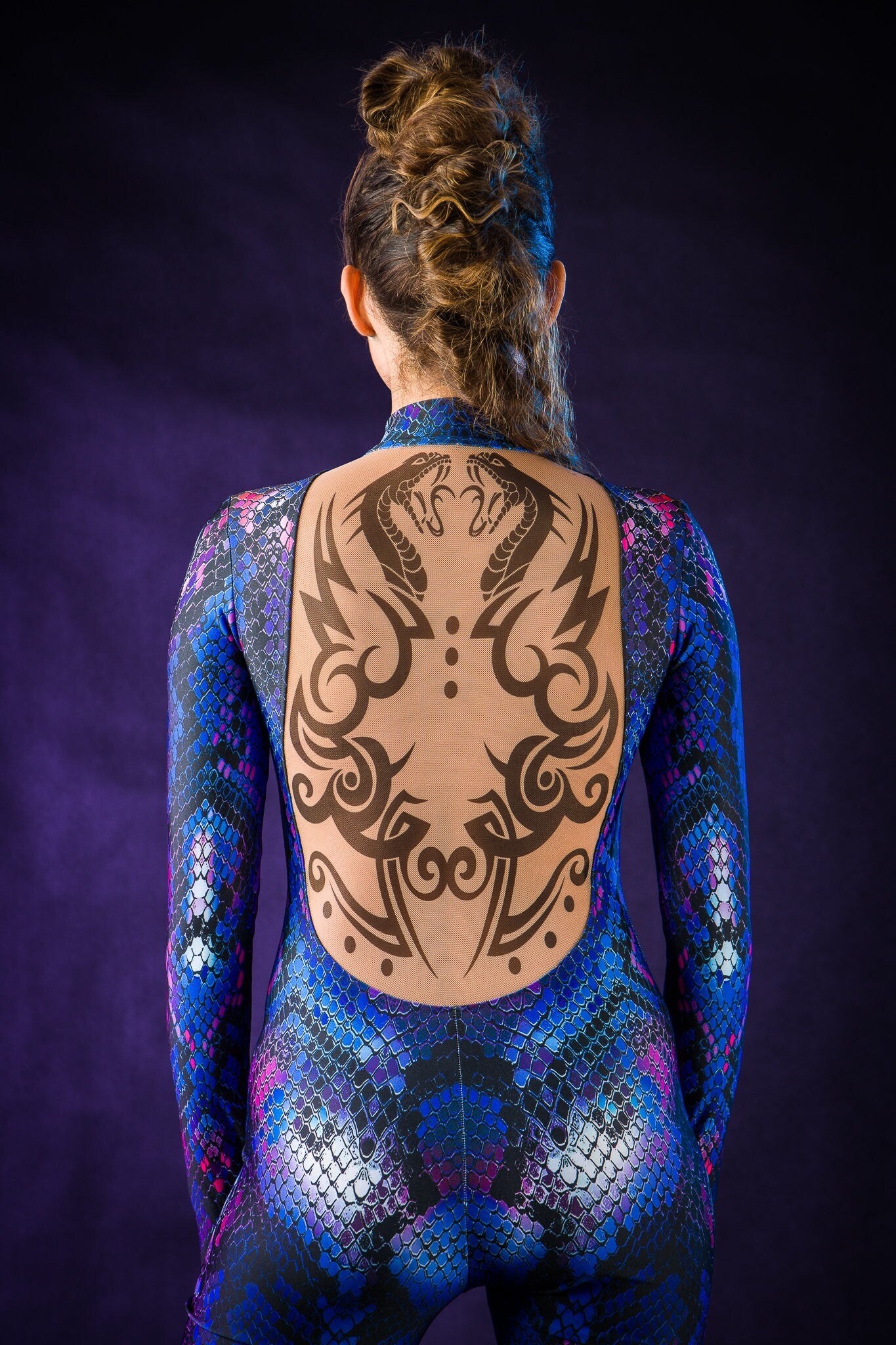 Close-up of the intricate tattoo effect and snake skin pattern on the Blue Snake jumpsuit, ideal for a bold Halloween look or festival fashion.