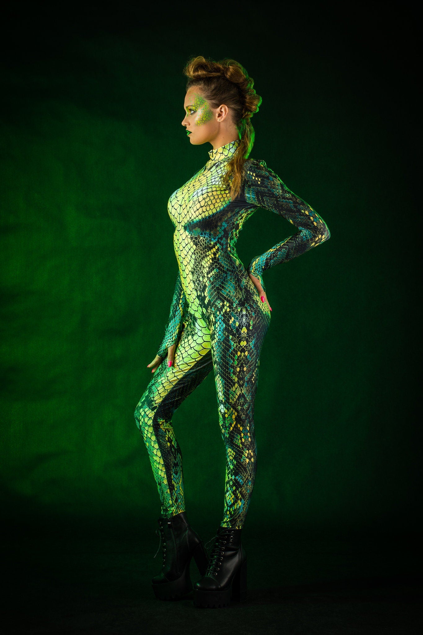 Woman posing in the Green Snake Halloween costume, highlighting the sleek green snake skin design and tattoo effect, great for Halloween events or as a unique festival outfit.