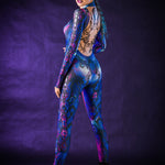 Woman wearing the Blue Snake costume, a full-body snake skin jumpsuit with tattoo details on the back, perfect for Halloween or standout festival outfits.