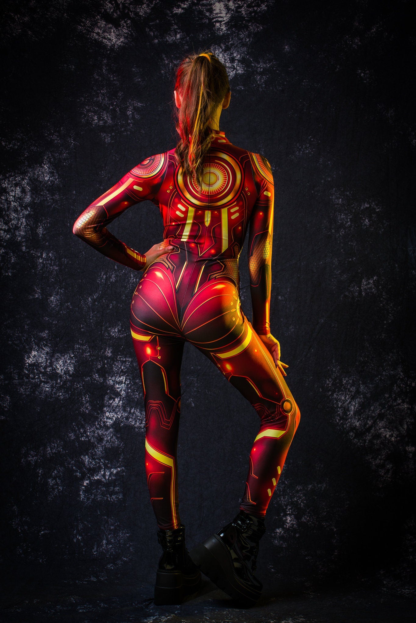 Close-up of the red and gold cyberpunk robotic design on the Cyber Hero costume, ideal for a bold Halloween or futuristic festival look.