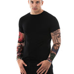 Man wearing the Zombie Circus T-shirt with tattoo sleeves, a long-sleeve shirt featuring zombie and circus-themed tattoo designs, perfect for Halloween events.