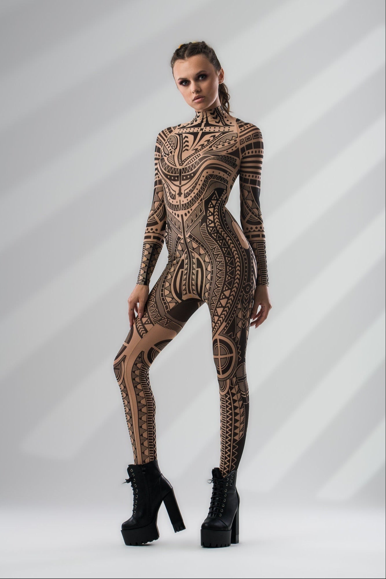Three-quarter side view of MAJESTIC TRIBAL Tattoo Catsuit for Women – emphasizing the detailed tribal tattoo effect and flattering fit.