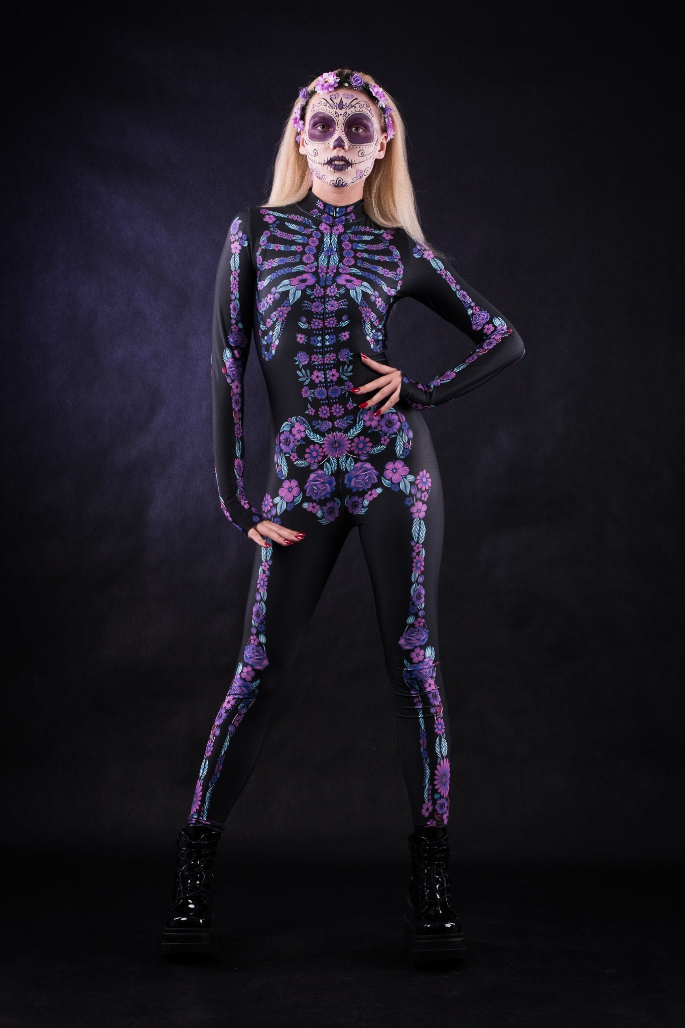 Woman posing in the Flower Skeleton costume, showcasing vibrant purple and blue skeleton design with flowers, ideal for Halloween or as a striking festival outfit.