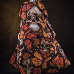 Woman posing in the Lady Orange Butterfly skeleton costume, showcasing the bold orange butterfly design, skeleton theme, and flowing kimono, great for Halloween or as a standout festival outfit.