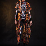 Woman posing in the Orange Monarchy Butterflies Halloween kimono cape, showcasing the bold butterfly design and elegant flow, ideal for Halloween parties or as a statement festival piece.