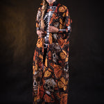 Close-up of the orange butterfly patterns on the flowing Halloween kimono cape, ideal for adding a dramatic touch to Halloween or festival outfits.