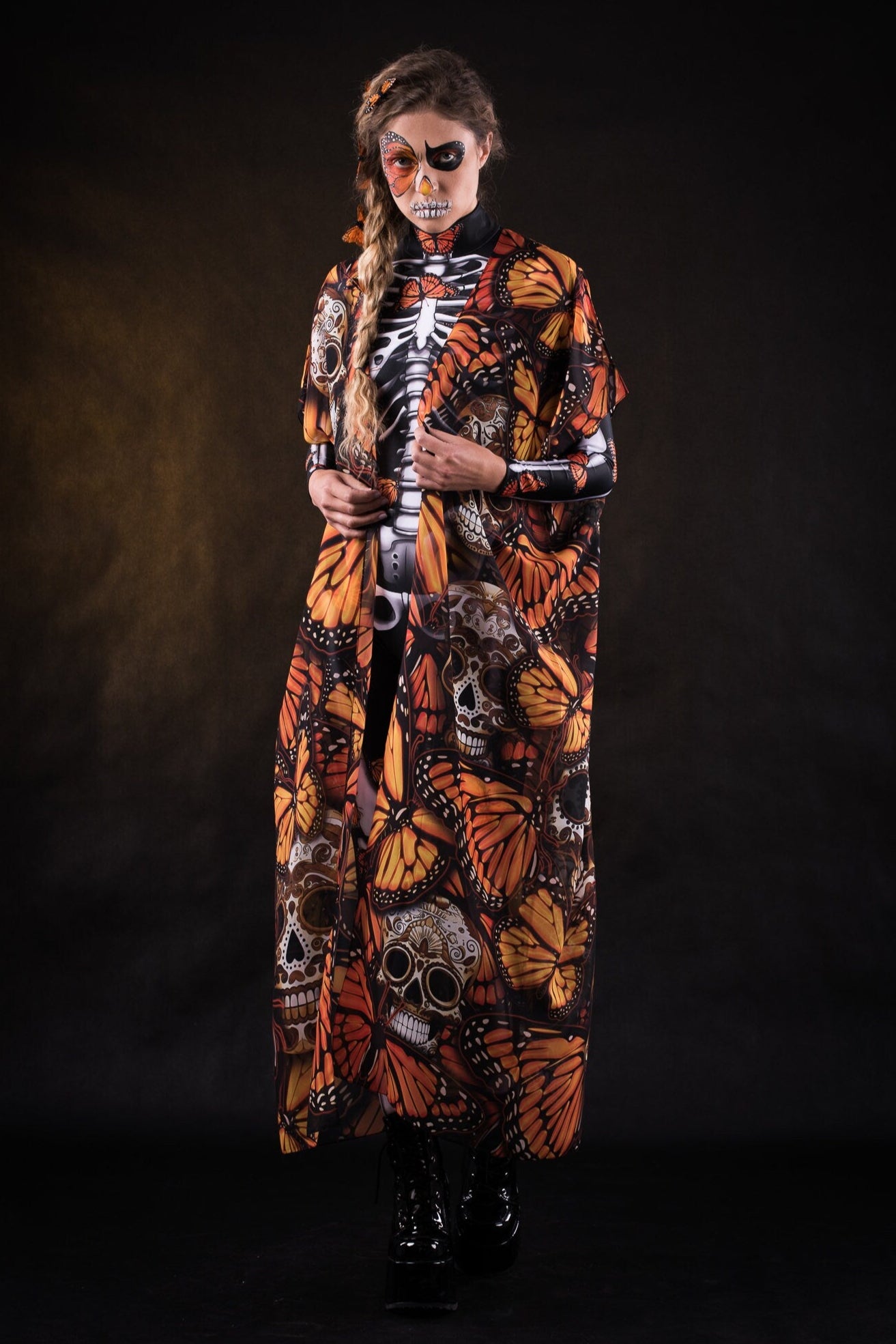 Close-up of the orange butterfly patterns on the flowing Halloween kimono cape, ideal for adding a dramatic touch to Halloween or festival outfits.