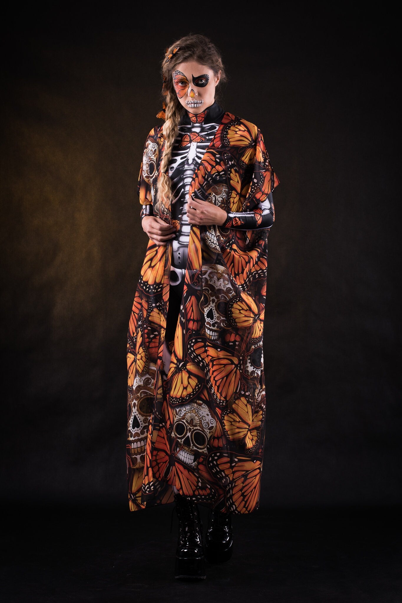 Close-up of the orange butterfly patterns on the flowing Halloween kimono cape, ideal for adding a dramatic touch to Halloween or festival outfits.