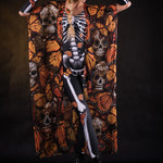 Woman posing in the Orange Monarchy Butterflies Halloween kimono cape, showcasing the bold butterfly design and elegant flow, ideal for Halloween parties or as a statement festival piece.