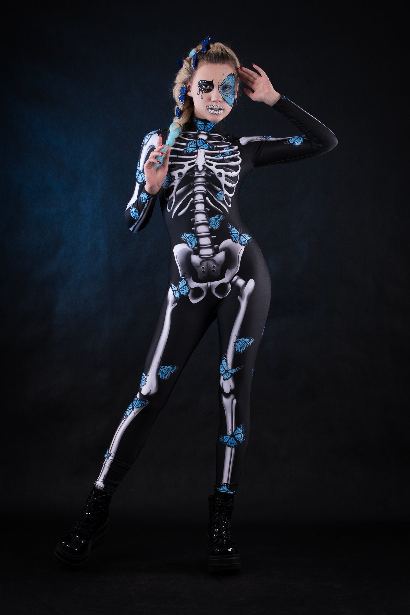 Woman posing in the Lady Blue Butterfly skeleton costume, highlighting the vibrant blue butterfly design, skeleton theme, and flowing kimono, great for Halloween or as a unique festival outfit.