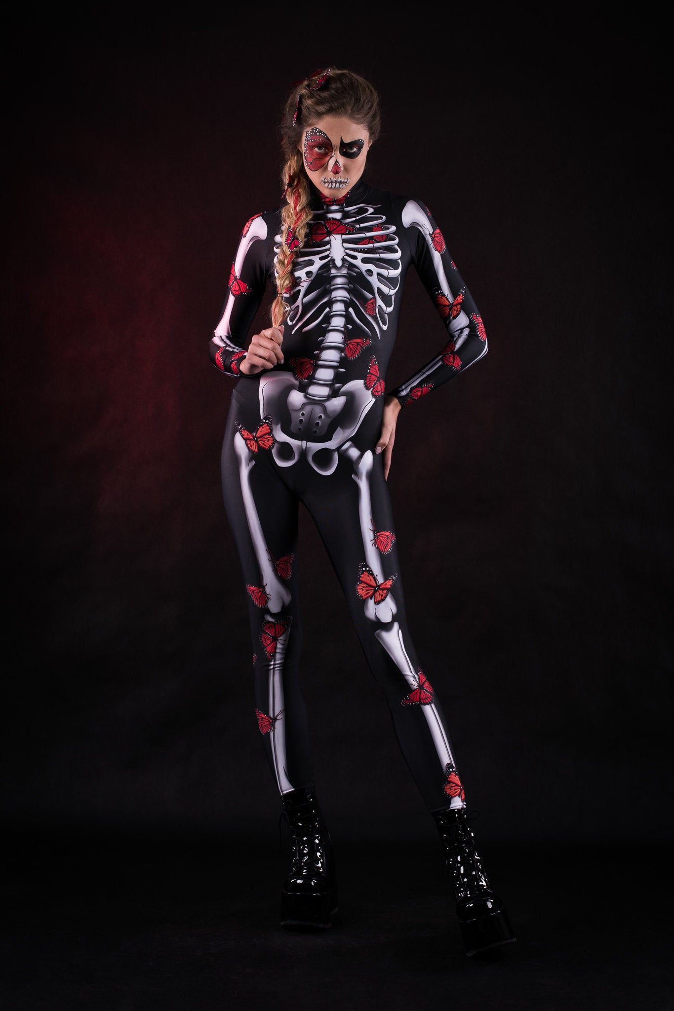 Lady Red Butterfly Halloween costume for women, featuring a full-body skeleton catsuit with vibrant red and blue butterfly accents, perfect for Halloween or Day of the Dead celebrations.