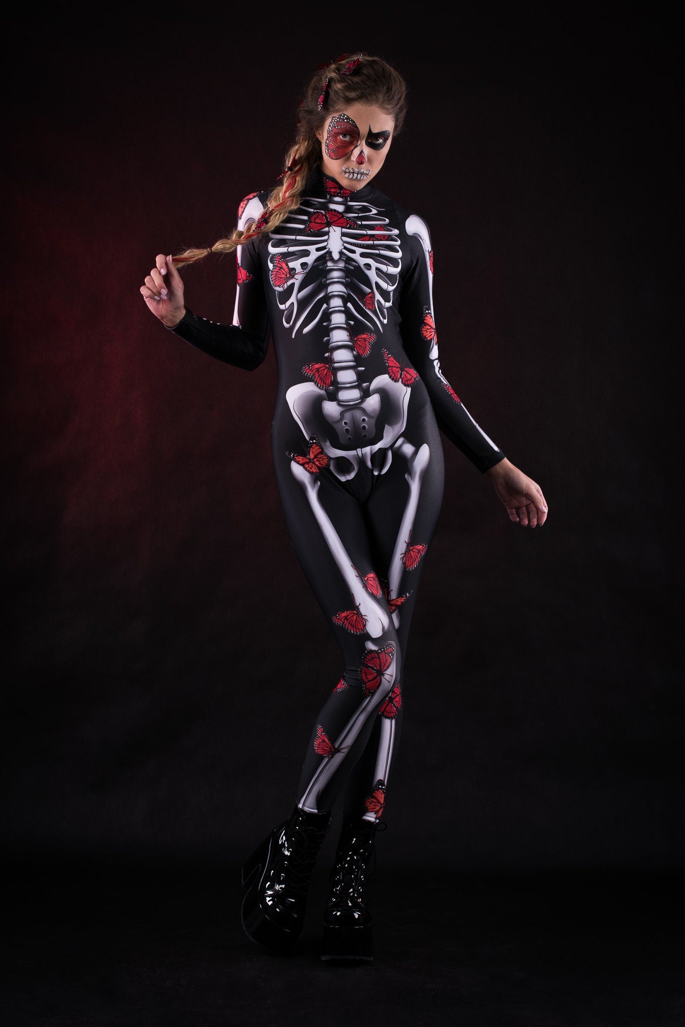 Woman posing in the Lady Red Butterfly skeleton costume, highlighting the vibrant butterfly design, skeleton theme, and flowing kimono, ideal for Halloween or as a striking festival outfit.