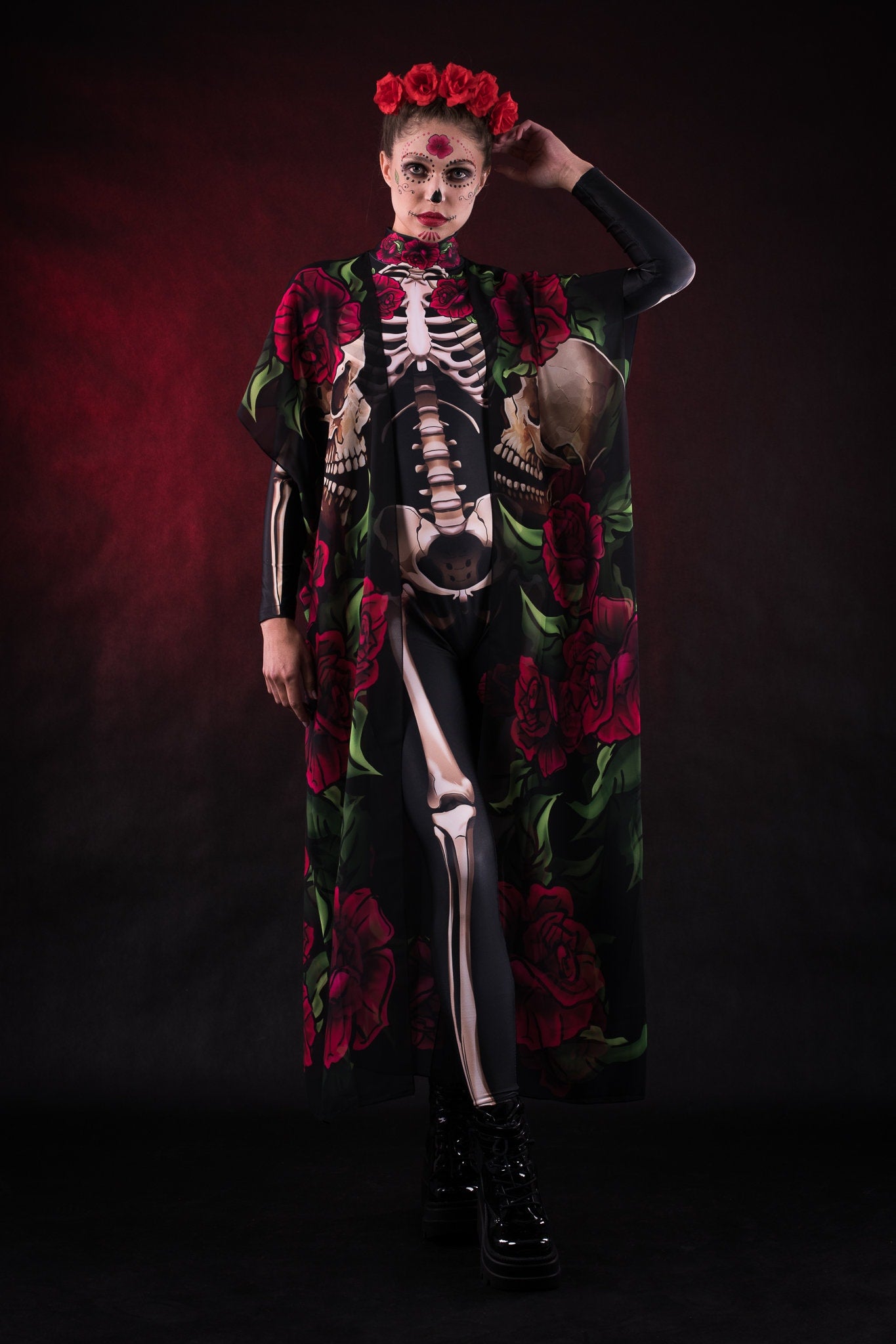 Women wearing a skeleton bodysuit with red rose. Kimono with roses. Styled for Halloween. The outfit is inspired by Day of the Dead.