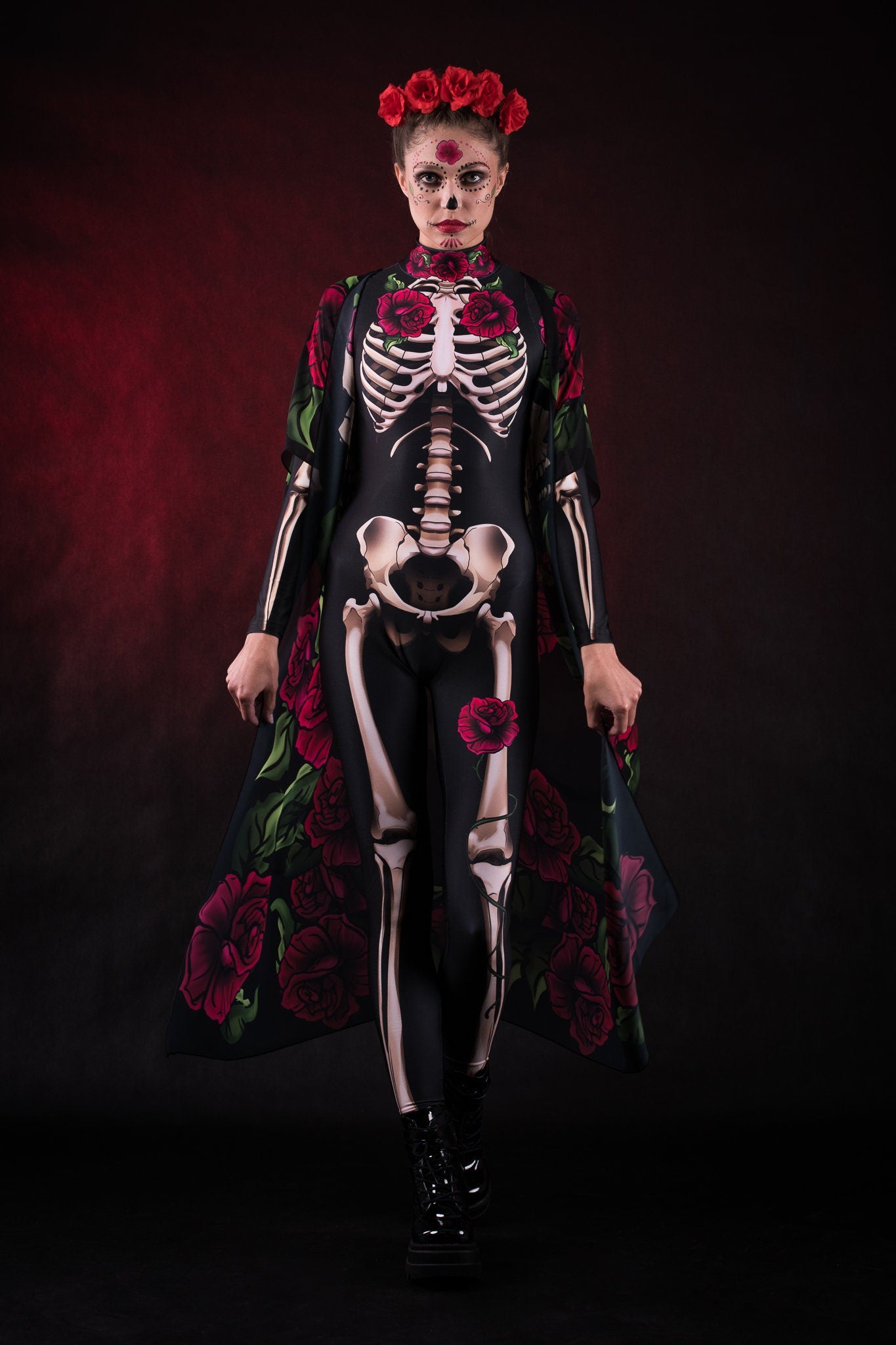 Woman posing in the Lady Death Halloween kimono costume, highlighting the flowing cape with skull and rose designs, great for Halloween parties or as a striking festival outfit.