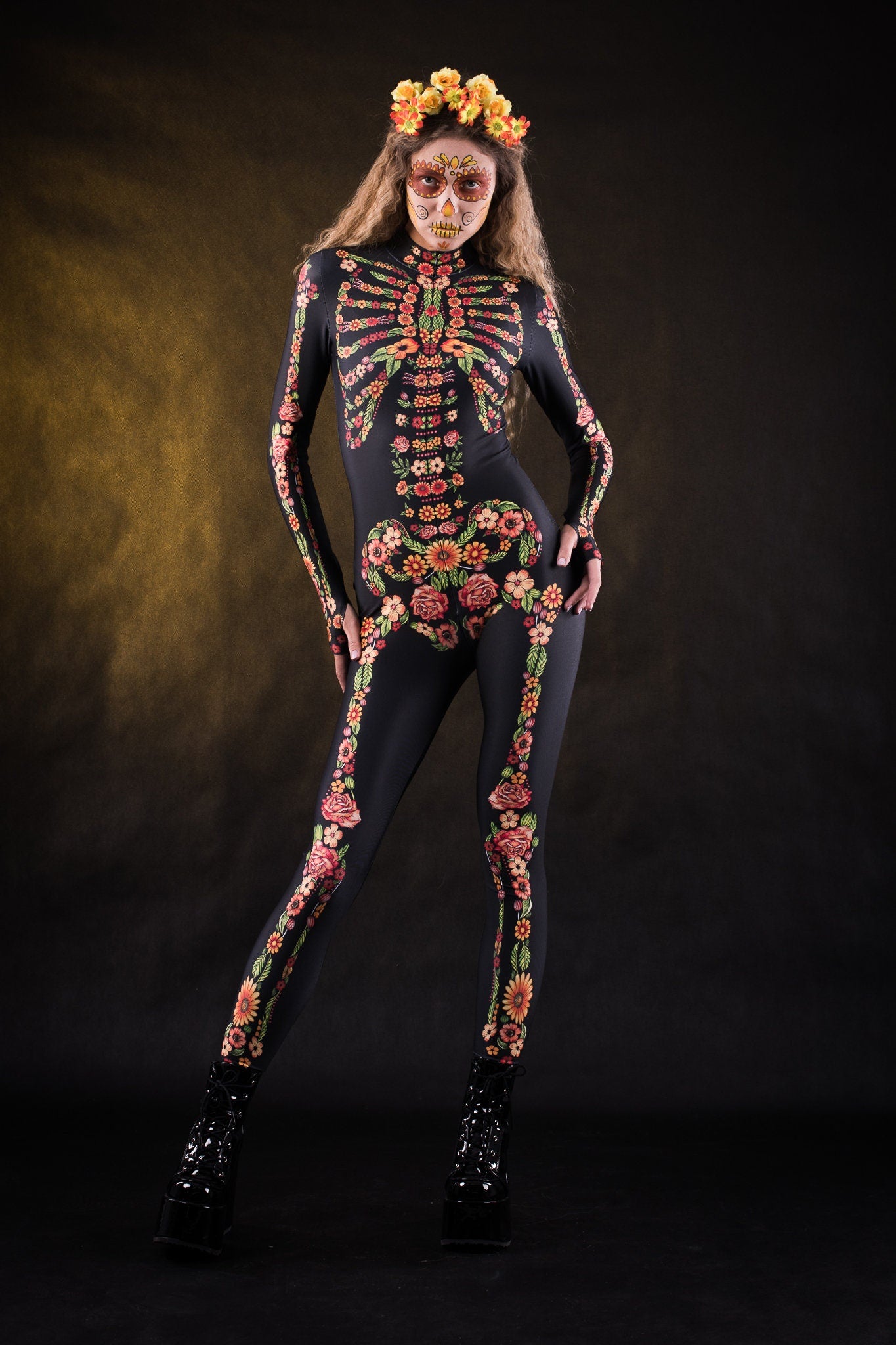 Woman posing in the Flower Skeleton costume, showcasing the colorful skeleton design with orange, yellow, and green floral patterns, great for Halloween or as a standout festival outfit.