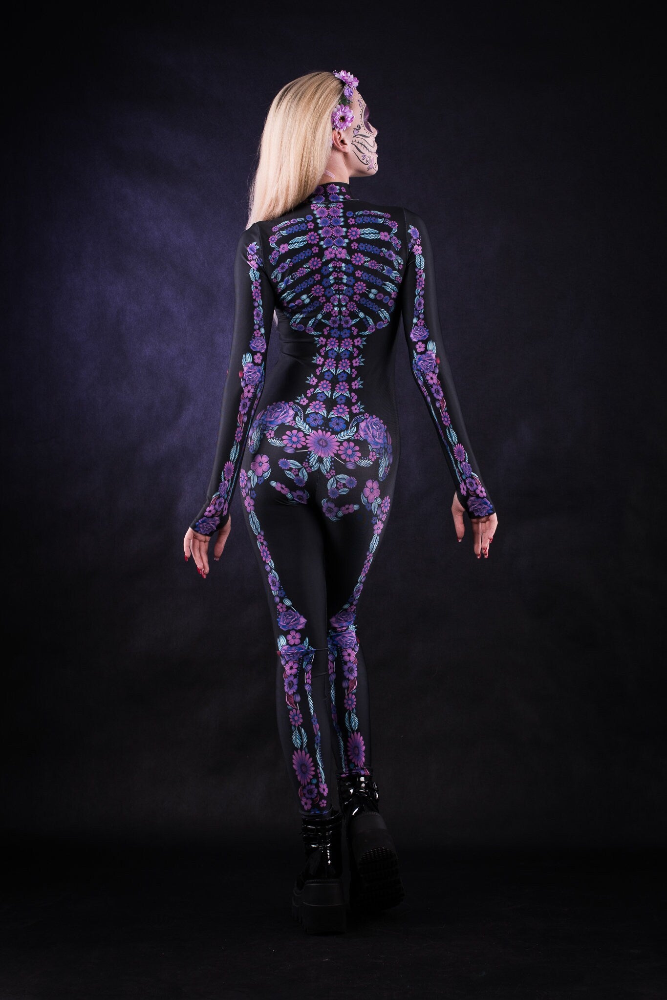 Close-up of the floral skeleton design on the full-body catsuit, with intricate purple and blue details, ideal for Halloween or festival fashion.