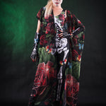 Woman posing in the Roses and Butterflies kimono cape, showcasing the vibrant rose and butterfly design, great for Halloween parties or as a unique festival outfit.