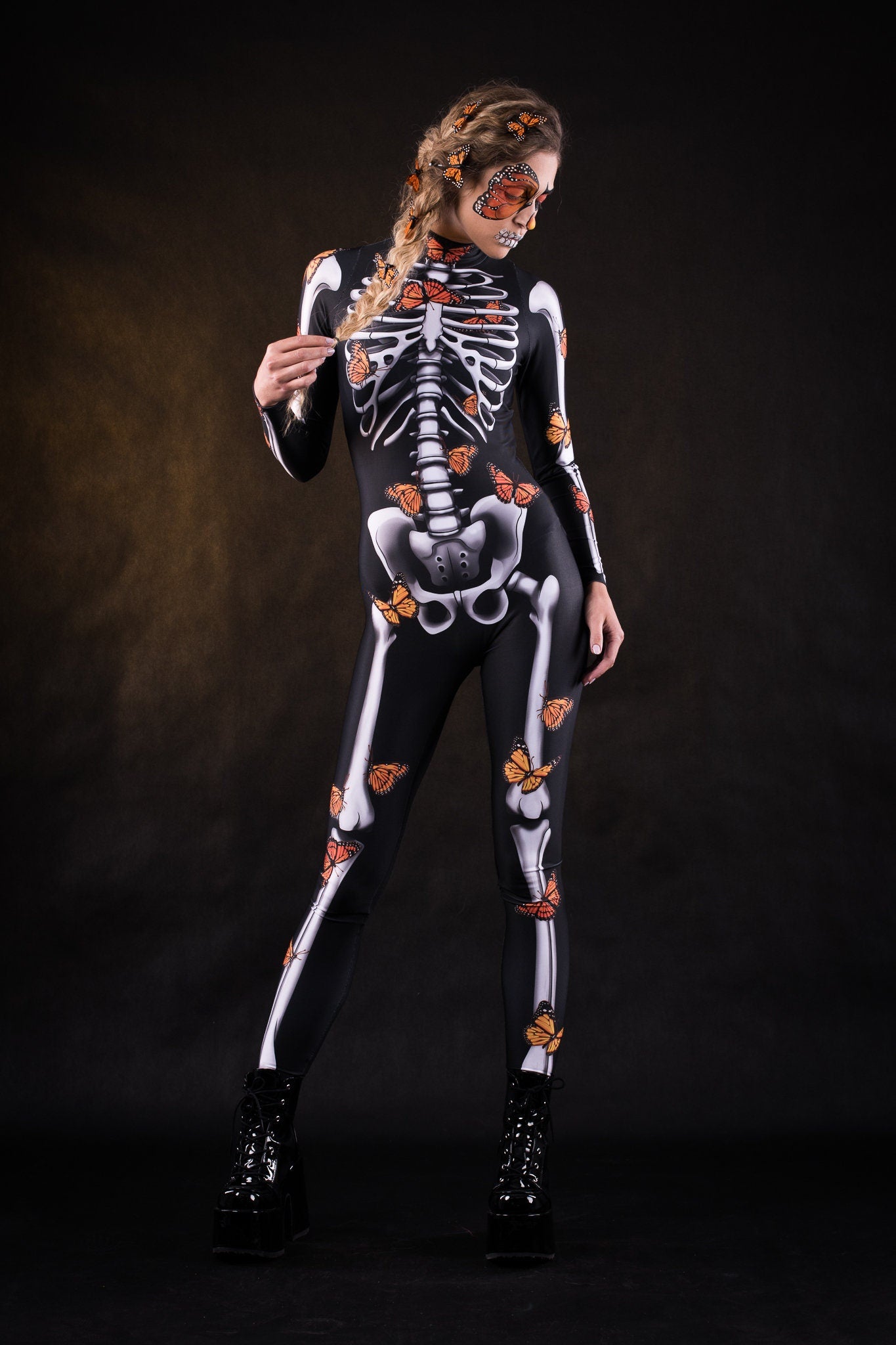 Lady Orange Butterfly Halloween costume for women, featuring a full-body skeleton catsuit with orange butterfly accents and a flowing kimono, perfect for Halloween or Day of the Dead celebrations.