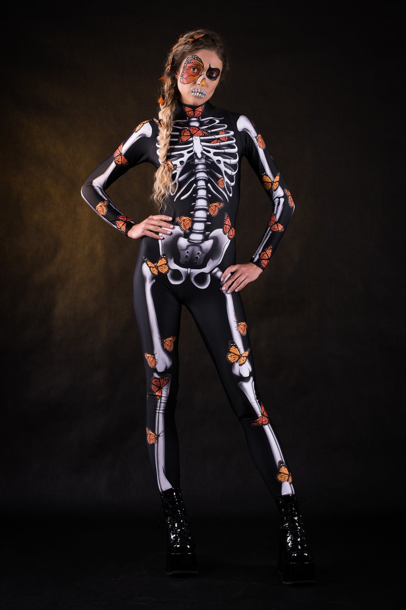 Lady Orange Butterfly Halloween costume for women, featuring a full-body skeleton catsuit with orange butterfly accents and a flowing kimono, perfect for Halloween or Day of the Dead celebrations.