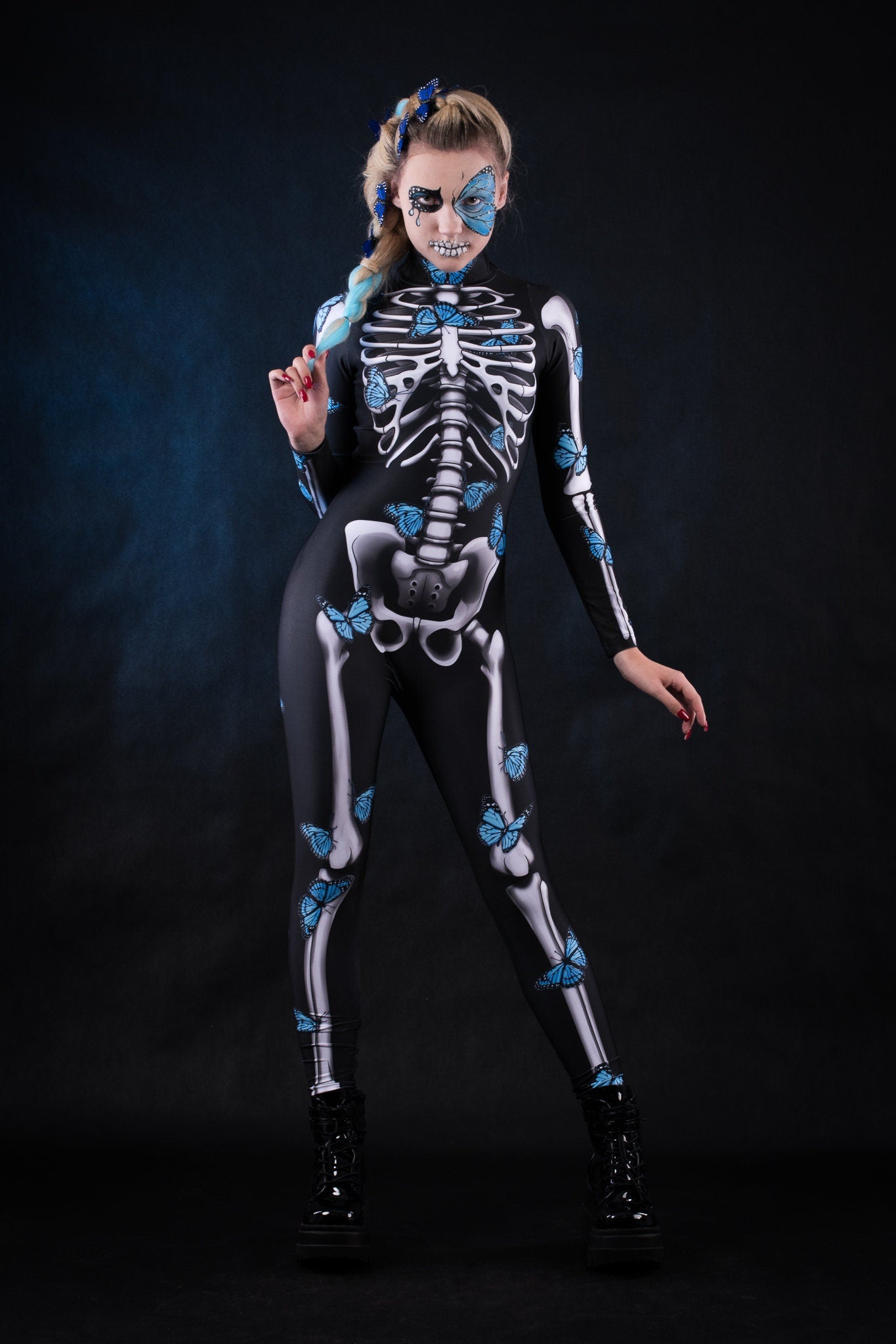 Lady Blue Butterfly Halloween costume for women, featuring a full-body skeleton catsuit with blue butterfly accents and a flowing kimono, perfect for Halloween or Day of the Dead celebrations.