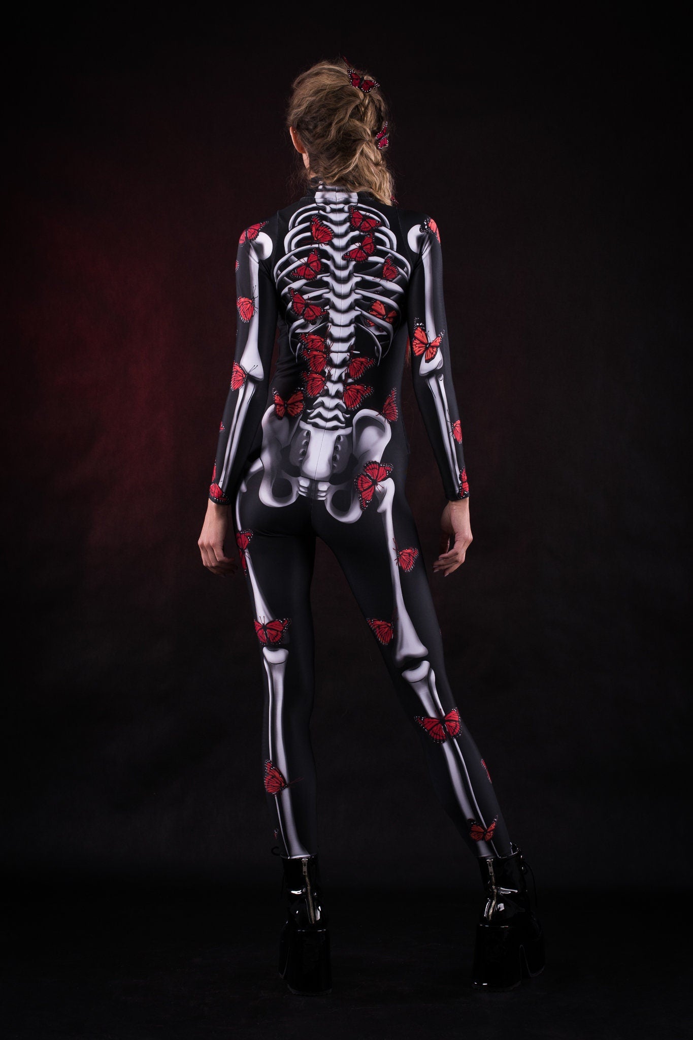 Close-up of the red butterfly and skeleton design on the Lady Red Butterfly costume, showcasing intricate details for a striking Halloween or festival outfit.