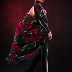 Woman wearing the Lady Death kimono Halloween cape, featuring a black cape with skull and rose accents, perfect for Halloween or Day of the Dead events.